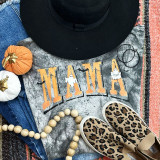 Mama Ghosts Screen Print Heat Transfer, Halloween-themed ghost design on a fabric background with other decorative items.