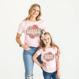 Mama Boho Floral DTF Heat Transfer, a mother and daughter wearing matching pink T-shirts with floral and text design.