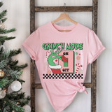 Green Guy Mode DTF Heat Transfer, pink T-shirt with Christmas-themed Grinch design including elf hat and candy canes.
