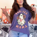 Boo-Jee Mama DTF Heat Transfer, Halloween-themed illustration of a ghost holding a mug and surrounded by flowers, on a purple t-shirt worn by a woman.