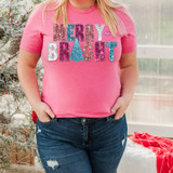 Merry and Bright Faux Sequins DTF Heat Transfer, close-up of a pink T-shirt with colorful glittery Christmas-themed text and decorations.