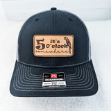 It's 5 o'clock Somewhere Parrot Leather Hat Patch, a black baseball cap featuring a leather patch with text and a parrot illustration.
