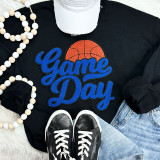 Basketball Game Day Chenille Patch, vibrant embroidered patch with a basketball and the words 'Game Day' in blue on a black sweatshirt.