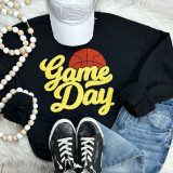 Basketball YELLOW Game Day Chenille Patch, vibrant yellow embroidered patch with the words 'Game Day' and a basketball graphic on a black sweatshirt.