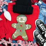 Sequin Gingerbread Man Patch, colorful and sparkly gingerbread man decorative patch with sequins and smiling face, perfect for holiday clothing and accessories.