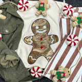 Sequin Gingerbread Man Patch, festive Christmas gingerbread man embroidered with sequins and decorated with colorful buttons, on a holiday-themed background with candy ornaments and striped fabric.