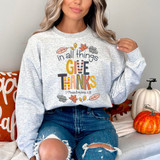 In All Things Give Thanks DTF Heat Transfer, woman wearing a sweatshirt with Thanksgiving-themed design and text.