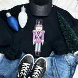 PINK Nutcracker Sequins Embroidered Patch, pink sequined nutcracker embroidery patch on black clothing.