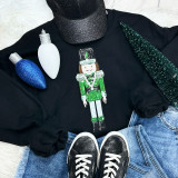 GREEN Nutcracker Sequins Embroidered Patch, festive decorated Christmas nutcracker patch with green sequins on black background