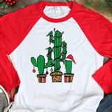 Cactus Christmas Tree Sublimation Transfer, festive cactus design with Christmas lights and Santa hat on one cactus, on a white and red long sleeve shirt, holiday apparel.