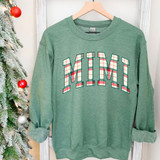 Mimi Plaid DTF Heat Transfer, green sweatshirt with plaid pattern text 'MIMI' in festive colors.
