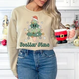 Feelin' Pine DTF Heat Transfer, festive Christmas tree with a Santa hat and holiday decorations on a sweatshirt.