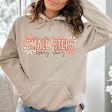 Small Steps Every Day DTF Heat Transfer, floral design on a beige hoodie with the phrase Small Steps every day.