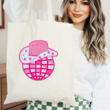 Cowboy Hat Sequin Disco Ball Chenille Patch, colorful embroidered patch featuring a pink cowboy hat, a disco ball, and a starry design on a white tote bag.