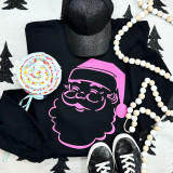 Pink Santa PUFF Screen Print Heat Transfer, vibrant pink and black Santa face design printed on a black sweatshirt with Christmas decorations around it.