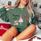 The Nutcracker Before Christmas DTF Heat Transfer, graphic design featuring elegant dancing characters and the phrase 'The Nutcracker Before Christmas' on a green sweatshirt.