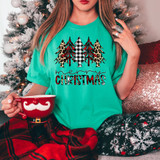 Merry Christmas Leopard Buffalo Plaid DTF Heat Transfer, festive holiday graphic design featuring decorated Christmas trees in leopard print, buffalo plaid, and red silhouette patterns on a turquoise t-shirt.