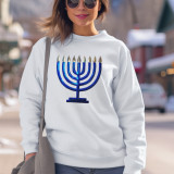 Menorah Sequin Patch, decorative sequin patch featuring a menorah design in vibrant blue and silver colors on a white sweatshirt.