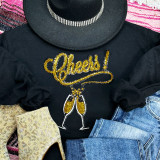 CHEERS! Champagne Sequin Patch, black sweatshirt adorned with glittering gold and silver sequin patch featuring the word 'Cheers!' with two champagne glasses.