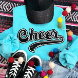Black Cheer Sequin Patch, close-up of a black sequin patch with the word 'Cheer' embroidered in white on a turquoise t-shirt.
