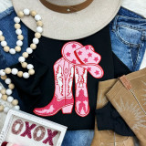 Boots + Hat Chenille Patch, pink cowboy boots and hat embroidered patch on black fabric.
