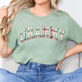 Grammy Plaid DTF Heat Transfer, woman wearing a light green t-shirt with bold 'GRAMMY' text in a plaid pattern.