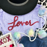 LOVER Red Sequin Patch, vibrant red heart-shaped sequin patch with the word 'Love' written in cursive, on a purple fabric background.