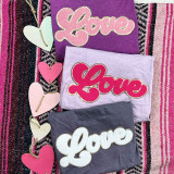 Light Pink Love Chenille Patch, pink chenille patch with the word 'Love' in cursive, embroidered with gold thread.