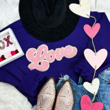 LIGHT PINK LOVE Chenille Patch, pink and glittery embroidered love patch on purple sweatshirt with other fashion accessories.