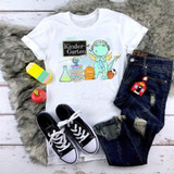 Back To School Dragon Blue Kindergarten Sublimation Transfer, children's white t-shirt with a cartoon dragon and school-related graphics.