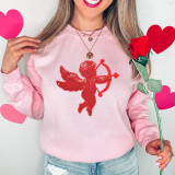 Red CupID Sequin Patch, shiny red applique of Cupid with bow and arrow on pink sweatshirt.