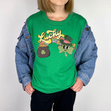 Lucky Rainbow Retro DTF Heat Transfer, colorful graphic of a leprechaun hat and a pot of gold on a green t-shirt.