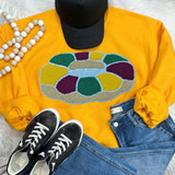 King Cake Sequin Chenille Patch, colorful stitched design of a king cake on a yellow sweatshirt.