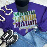 Mardi Gras Sequin Patch, colorful and sparkly sequin patch with the words 'Mardi Gras' in multicolored letters on a purple sweatshirt.