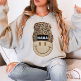 Mama Beanie Happy Face Sequin Patch, a woman wearing a sweatshirt featuring a smiley face with a leopard print beanie patch embroidered with the word MAMA.