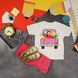 Back To School Pink Vintage Truck Sublimation Transfer, flat lay of a white t-shirt with a pink vintage truck and school supplies, notebooks, stationery, and accessories on colorful background.