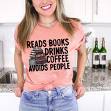 Reads Books Drinks Coffee Avoids People Heat Transfer T-Shirt, a woman wearing a pink t-shirt with black text and a stack of books and coffee mug graphic, in a kitchen setting.