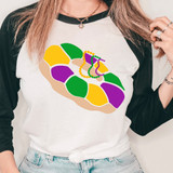 King Cake With Beads DTF Heat Transfer, colorful digital illustration of a king cake decorated with beads on a t-shirt.