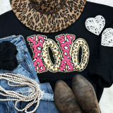 Leopard XOXO Chenille Sequin Patch, colorful patch with leopard print pattern on black clothing.