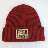 F*ck Cancer Leather Hat Patch, red knitted beanie hat with a beige patch displaying the words "F*ck Cancer" and a ribbon symbol.