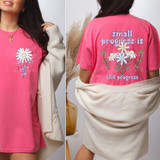 Small Progress Is Still Progress SET DTF Heat Transfer, pink t-shirt with floral graphic and text design.