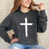 Distressed Cross WHITE DTF Heat Transfer, white distressed cross design on a black sweatshirt worn by a woman.