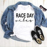 Race Day Vibes Sublimation Transfer, white t-shirt with 'Race Day Vibes' text and a casual outfit with jeans jacket, sunglasses, and sneakers.