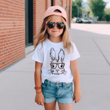 Leopard Bunny Glasses DTF Heat Transfer, a product featuring a cute bunny illustration with leopard-print glasses on a girl's t-shirt