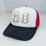 Baseball Chenille Numbers with Gold Glitter, a trucker-style cap with large white and embroidered gold and red baseball-themed numbers 20 on the front.