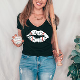 Baseball Lips Distressed DTF Heat Transfer, woman holding baseball and baseball bat, wearing black t-shirt with lips graphic design.