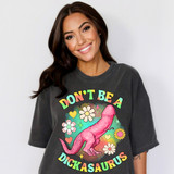 Don't Be A Dickasaurus DTF Heat Transfer, colorful graphic design of a pink dinosaur with flowers and hearts on a black T-shirt.
