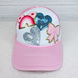 Pink Ribbon BOW Glitter Chenille HAT/POCKET Patch, a pink and white baseball cap with colorful sequin rainbow, heart, bow, and cloud patches.