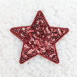 RED sequin STAR HAT/POCKET Patch, a red star-shaped patch decorated with shiny sequins and a fabric border on a white textured background.