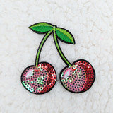 Cherry Embroidered Sequin Hat/Patch, embroidered patch featuring cherries with green leaves and pink, red, and iridescent sequins for decorative embellishment.